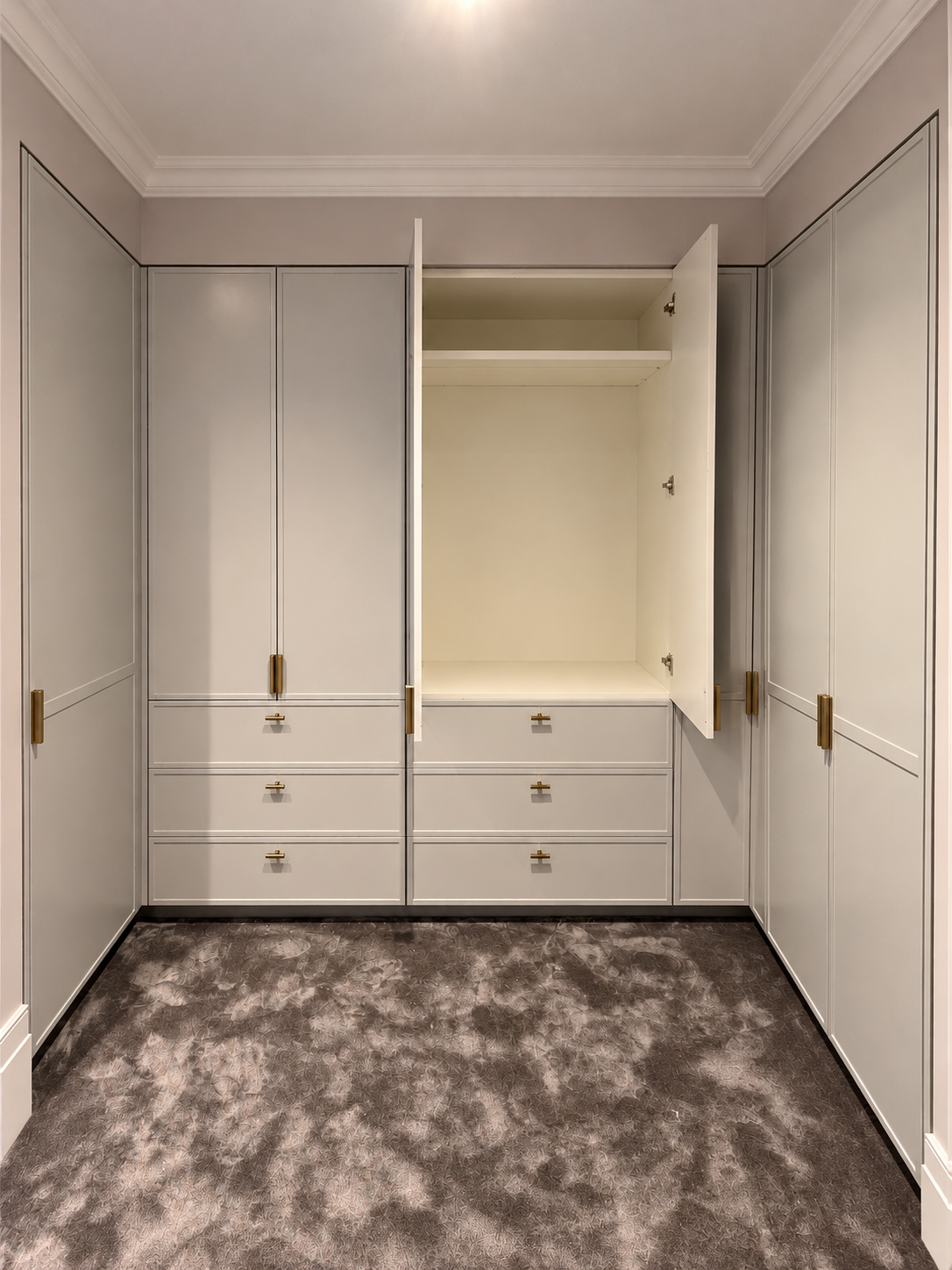 White walk-in wardrobe with drawers and open cupboard